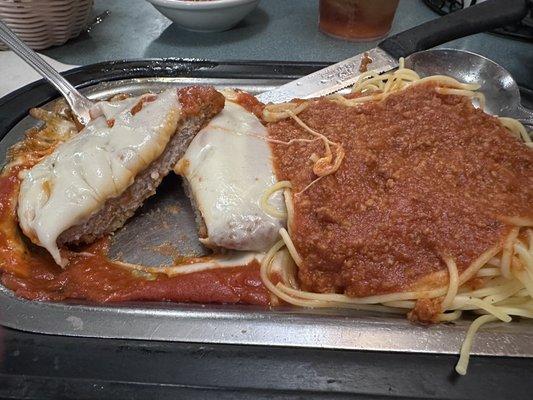 Veal Parmigiana with spaghetti with meat sauce.