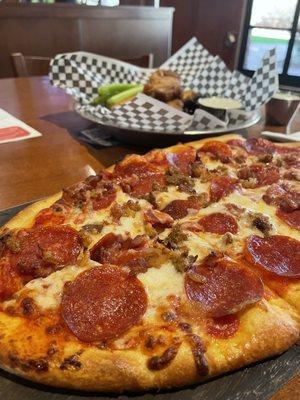 Three little pigs pizza- bacon, pepperoni, sausage