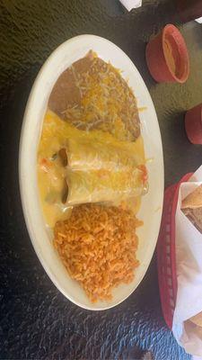 Cheese on cheese enchiladas with rice and beans