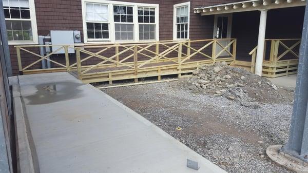 Custom treated/composite deck and ramp to match existing design.