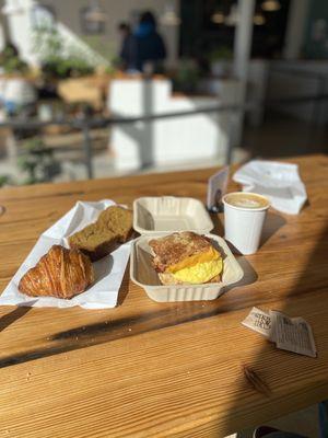 Cappuccino, Croissant, bacon egg and cheese, ginger pumpkin bread.