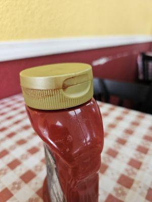 Dried ketchup around the lid.