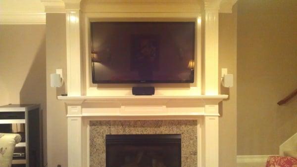 Flat TV wall mounted w/ 5.1 surround system installed