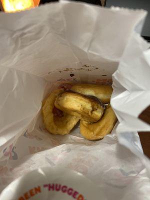 A bag of a half dozen donuts instead of a box