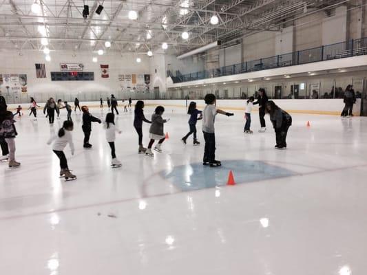 Kids taking their ice skating lessons on a Friday night!