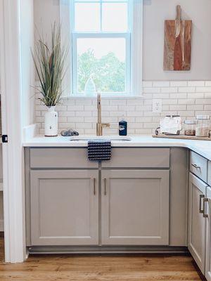 A white subway tile installed for a backsplash