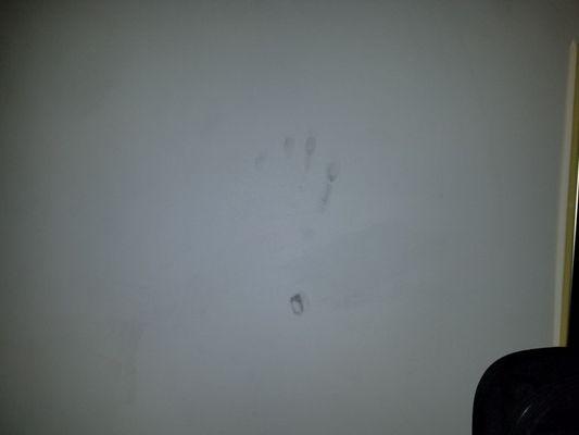 Dirty hand prints on the wall