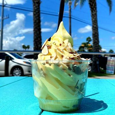 Pineapple Dole soft serve with sliced almonds