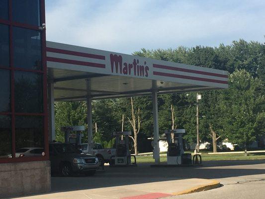 The gasoline station attached to the side of the grocery store