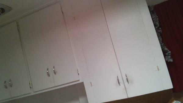 Brought to you from the 50's: awful outdated kitchen cabinets that don't close!