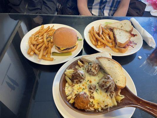 Cheeseburger, avocado sandwich, penne pasta with meatballs.