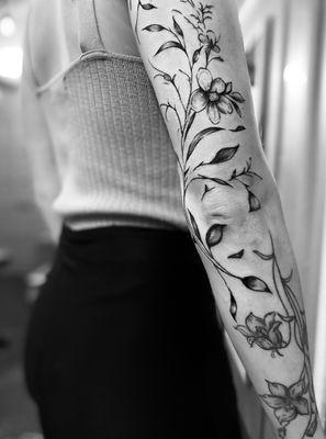 Stunning Fine Line Floral sleeve.