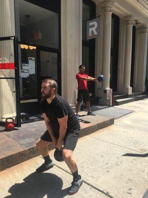 Mid kettlebell swing on a beautiful Saturday.