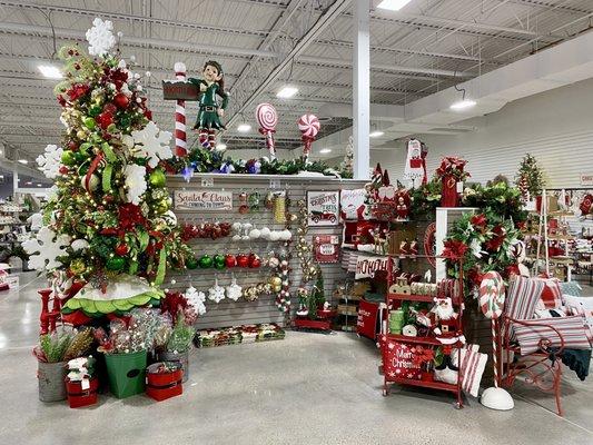 Another Christmas display with a fun decorated tree on the left.