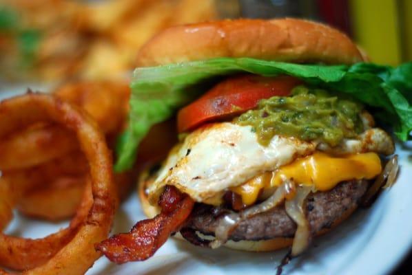 The most delicious $5 build-your-own-burger ever! This one includes beef, cheddar, fried egg, bacon, grilled onions, and guac