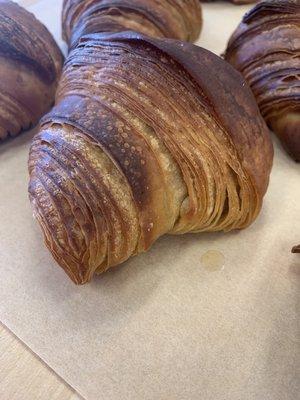 Hand laminated croissants made with whole grains.