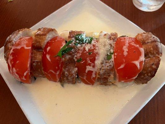 Stuffed Antonella Bread: Mozzarella, Tomatoes, basil, and cream sauce.