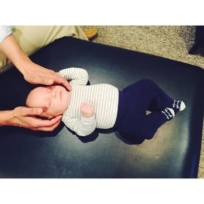 This is sweet baby Jackson celebrating his one month birthday with his FIRST adjustment!!!...