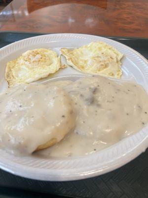 Eggs with a biscuit and gravy.