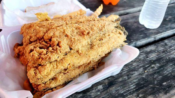 Pan trout over fried okra and fries