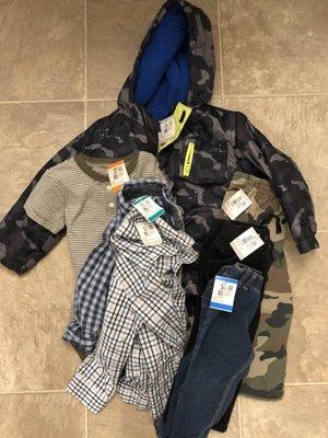 7 items of children's clothing that cost $10.32 during a 50% off sale day