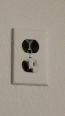 Busted outlet! Very dangerous!