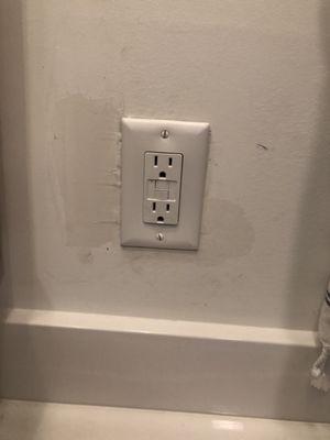 This is the exact outlet in our bathroom. They left it complete and repaired like this. Wow!