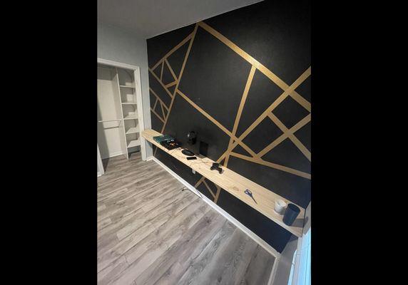 Teenage room remodel. Wall completed years ago by us. Laminate flooring and closet system installed. Custom made wall mounted desk.