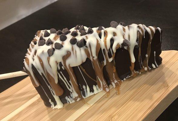 Caramel chocolate cheesecake on a stick