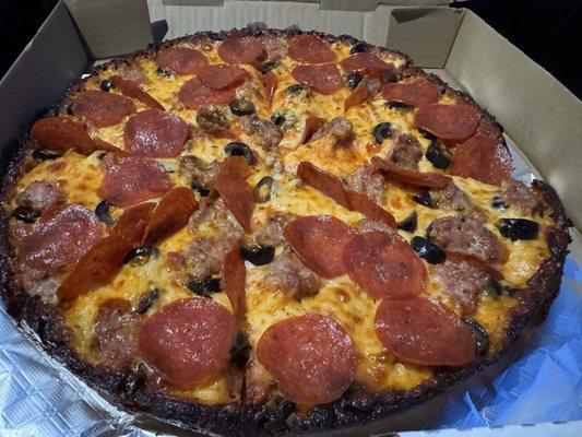 Large pie with pepperoni, sausage and olives.