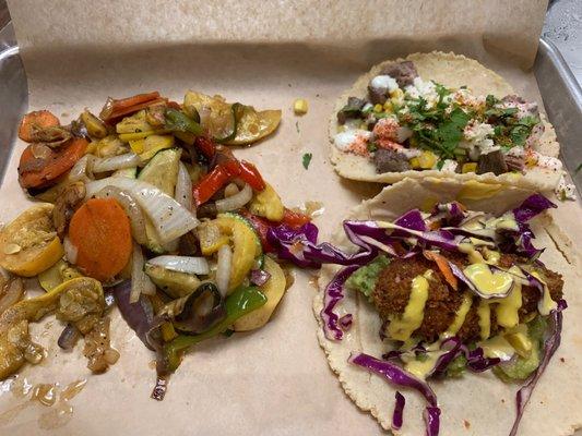 Avocado tacos and skirt steak tacos with grilled vegetables.