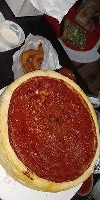 Their  version of deep dish... it was stuffed pizza lacked cheese and way to much dough. Couldn't even cut the pizza