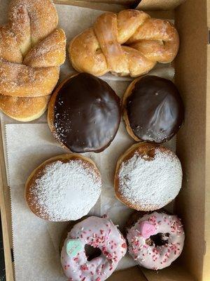 Donut assortment (bow tie, cinnamon twist, Boston cream, lemon filled, blueberry cake)