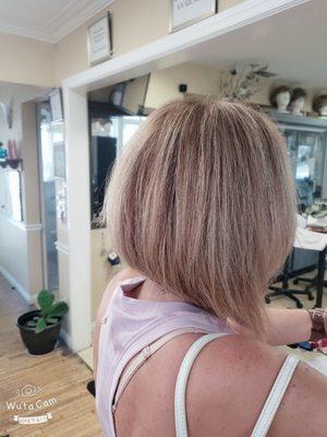 Shoulder length bob with a hint of texture on light brown and blonde highlights!