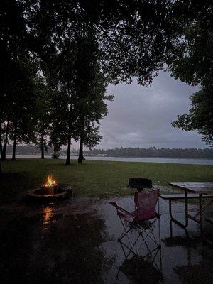 Campsite with wood Burning in Solo Stove While raining