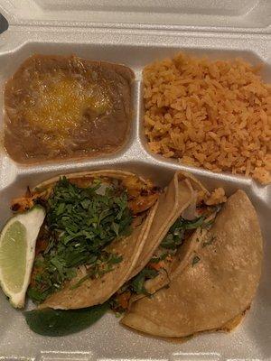 Shrimp tacos, refried beans, & rice.