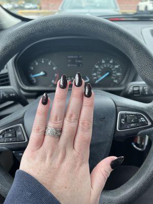 Pointy black nails with red glitter