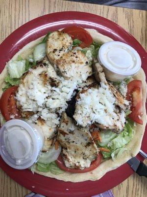 Grilled chicken salad. Comes in a pizza dough base. Delicious! We will be back!