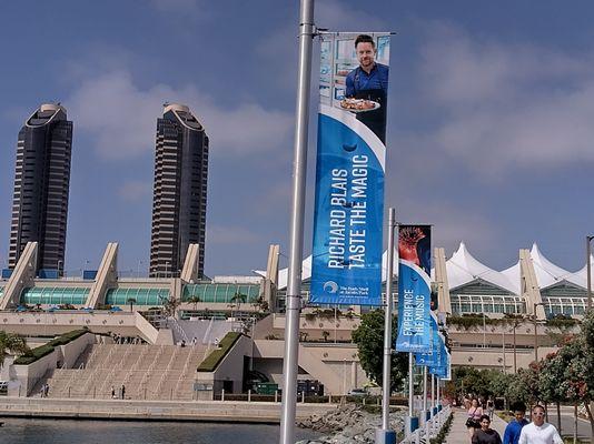 These are just banners not concert sign that can be seen by the public and the dates that need to be seen. Flags are not the right way.