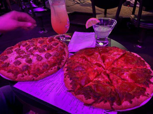 Sausage and pepp pizzas, Mai tai, and lemon drop martini