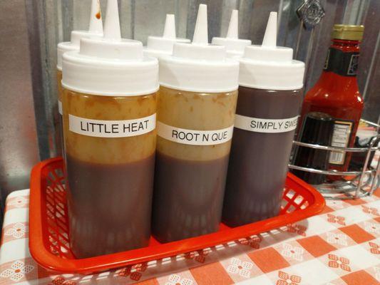 Some of the six different sauces they offer on the table. The "Root N Que" is root beer based.