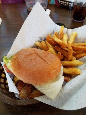 Double bacon cheeseburger with lettuce and tomato.