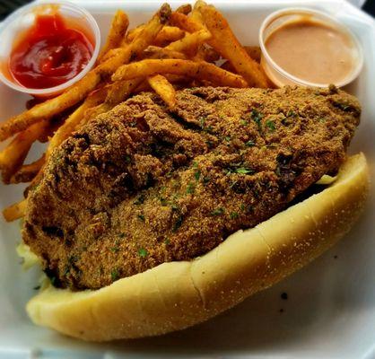 Hand-dipped catfish po'boy with cajun fries and remoulade