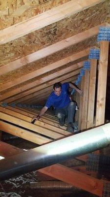 Whole Home Inspections evaluating an attic space in Phoenix AZ.