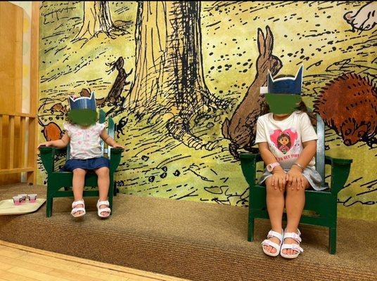 Hundred Acer Woods backdrop and small stage for Story Time.