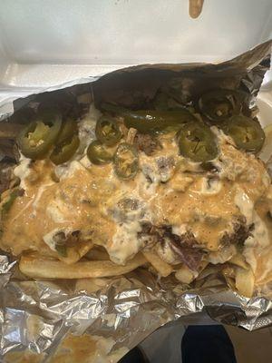 Loaded Philly Cheesesteak Loaded fries with Philly meat, melted cheeses, peppers, onion, spicy jalapeo ranch and chipotle Mayo