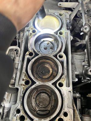 Benz engine rebuild. Damaged piston