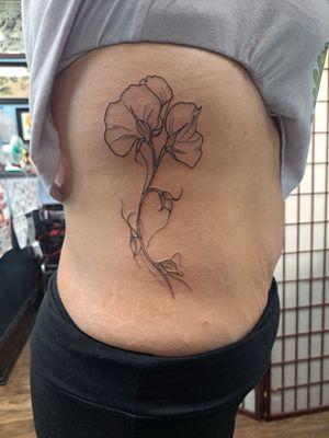 Sweet pea rib tattoo.