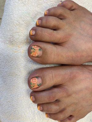 Orange slice nail art.