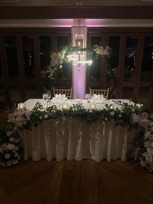 Keani and Sly decorated the sweethearts table, assembled and decorated the arch. They also hung our neon sign